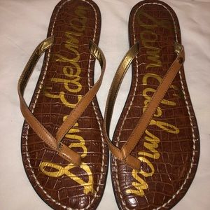 SAM EDELMAN. brown flip flops. NEVER WORN.